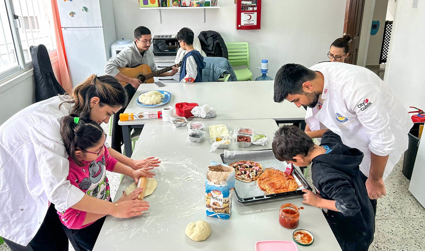EMU Students Organizes a Day Filled with Food and Music for the Visually Impaired Children